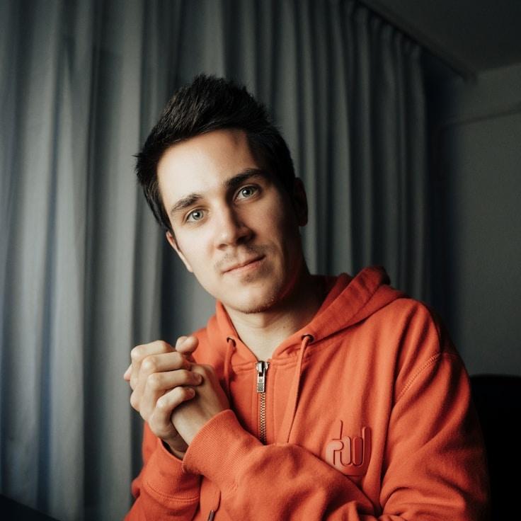 Kaveri Mehta, Lead Design Curator at RivenMeadowCove, reviewing corporate floral arrangements